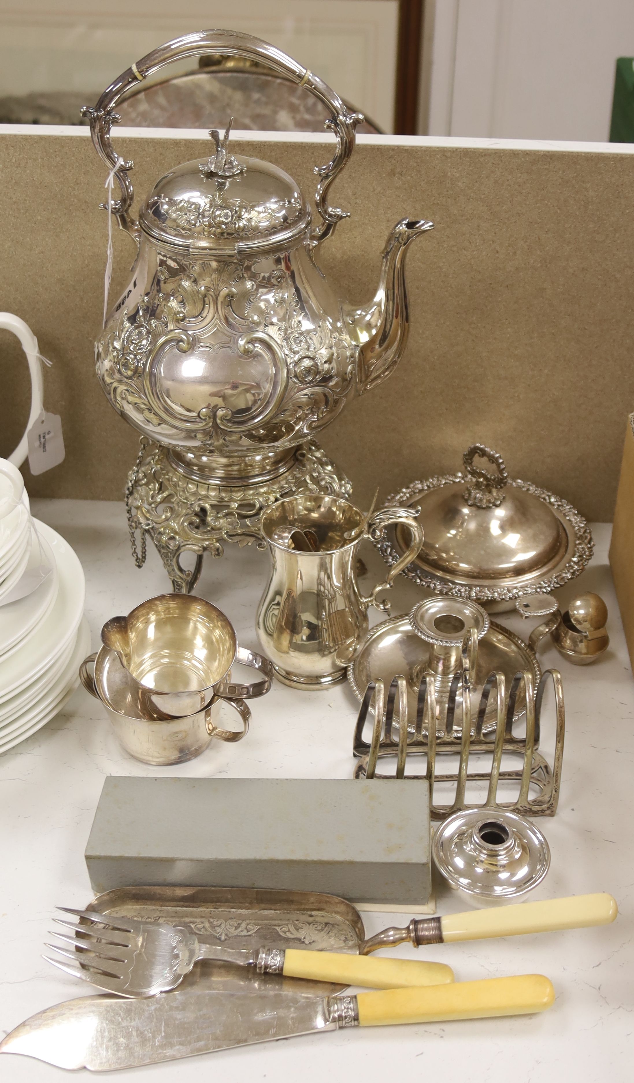 A silver plated tea kettle on stand with burner, 54cm high, and a small quantity of other plated items.